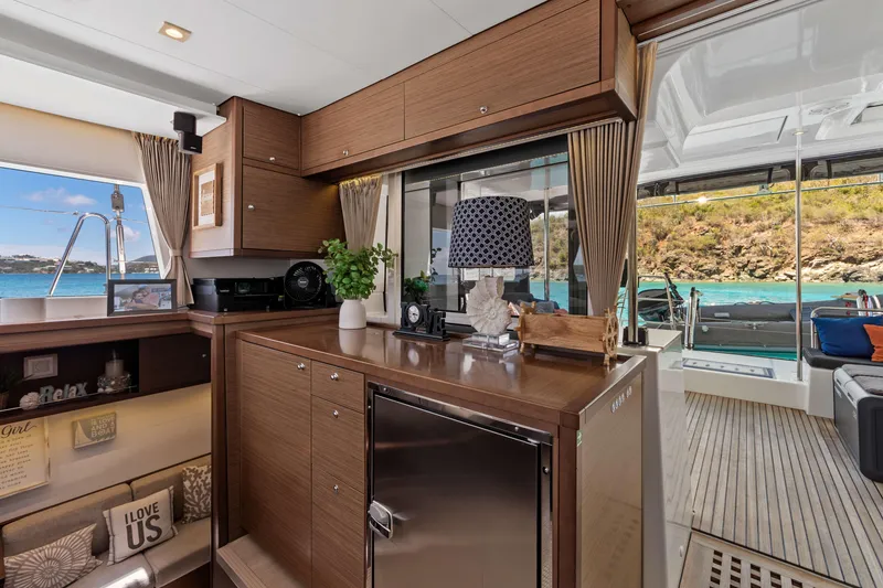 Slide: The Image of Luxurious interior of 2017 Lagoon 450 F yacht with elegant wood cabinetry and scenic ocean view. - 52