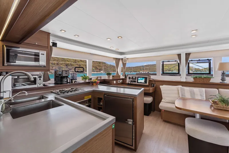Slide: The Image of Luxurious interior of 2017 Lagoon 450 F catamaran with modern kitchen and seating area. - 53