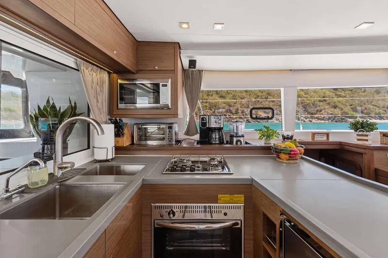 Slide: The Image of Modern kitchen interior on 2017 Lagoon 450 F yacht with ocean view. - 54