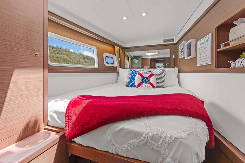 Slide: The Image of Luxurious cabin interior of 2017 Lagoon 450 F catamaran with cozy bed and nautical decor. - 56
