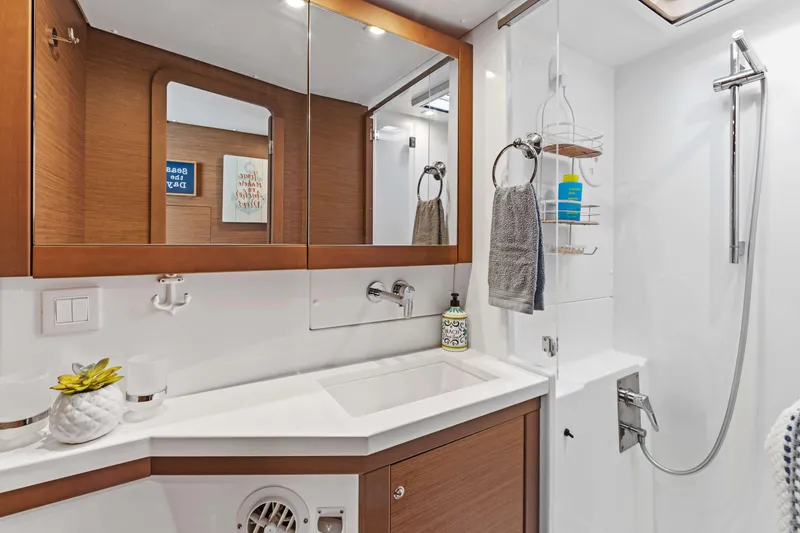 Slide: The Image of Luxurious bathroom in 2017 Lagoon 450 F yacht with modern fixtures and elegant wood accents. - 59
