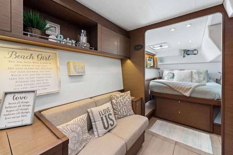 Slide: The Image of Interior of 2017 Lagoon 450 F yacht with cozy seating and bedroom area. - 61