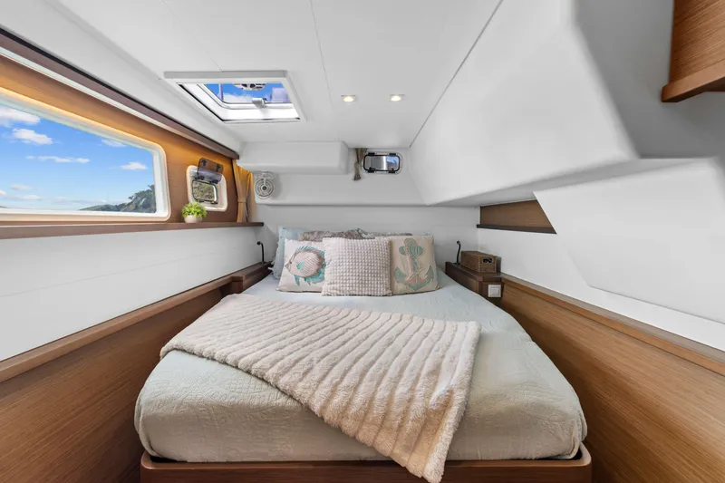 Slide: The Image of Luxurious cabin interior of 2017 Lagoon 450 F yacht with cozy bedding and scenic window view. - 62