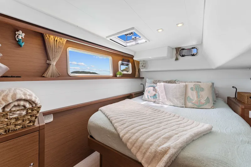 Slide: The Image of Luxurious cabin interior of 2017 Lagoon 450 F catamaran with cozy bedding and scenic window view. - 63