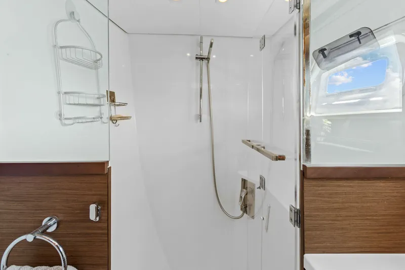 Slide: The Image of Modern shower area in 2017 Lagoon 450 F yacht with sleek design and window view. - 68