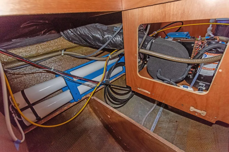 Slide: The Image of Interior view of 2017 Lagoon 450 F yacht showing wiring and mechanical components. - 71