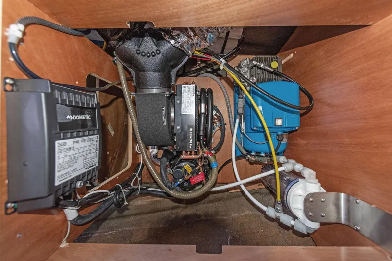 Slide: The Image of Engine compartment of a 2017 Lagoon 450 F yacht, featuring Dometic components and wiring. - 72