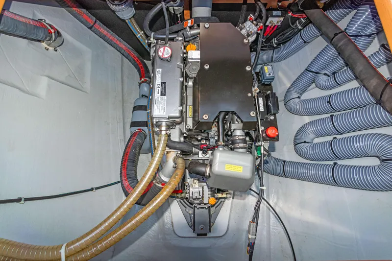 Slide: The Image of Engine compartment of a 2017 Lagoon 450 F catamaran, showcasing detailed mechanical components. - 75