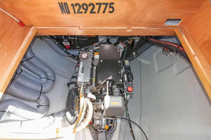 Slide: The Image of Engine compartment of 2017 Lagoon 450 F catamaran, showcasing mechanical components and wiring. - 80