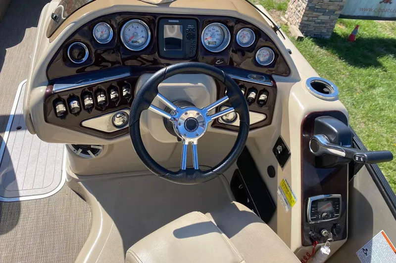 Slide: The Image of Steering console of a 2016 Starcraft MX 23 L boat with gauges and controls. - 7