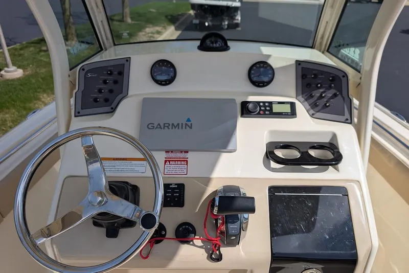 Slide: The Image of Dashboard of a 2017 Scout 225 XSF boat with Garmin navigation system. - 18