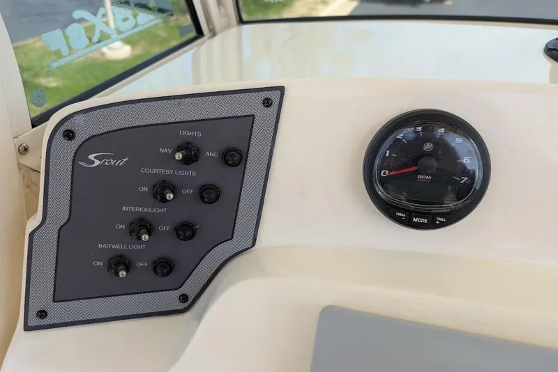 Slide: The Image of Control panel of 2017 Scout 225 XSF boat with switches and RPM gauge. - 19