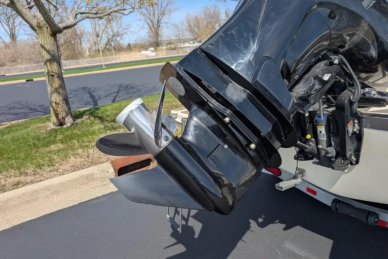 Slide: The Image of 2017 Scout 225 XSF boat motor and propeller in a parking lot. - 31
