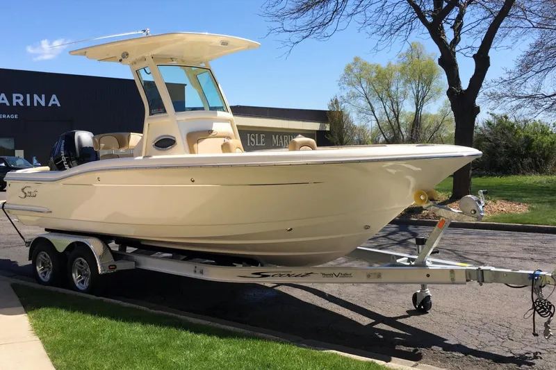 Slide: The Image of 2017 Scout 225 XSF boat on trailer at marina, sunny day. - 34