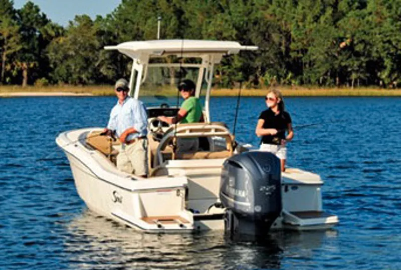 Slide: The Image of Manufacturer Provided Image: 2017 Scout 225 XSF boat on a lake with three people onboard. - 6