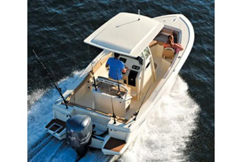 Slide: The Image of Manufacturer Provided Image: 2017 Scout 225 XSF boat cruising on water, rear view. - 7