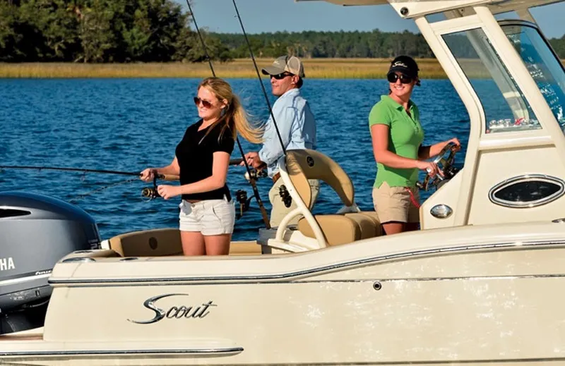 Slide: The Image of Manufacturer Provided Image: People fishing on a 2017 Scout 225 XSF boat in a scenic lake. - 8