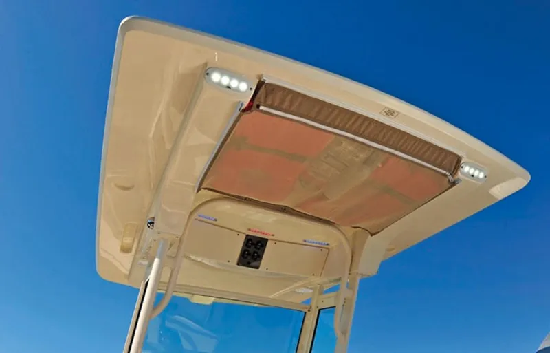 Slide: The Image of Manufacturer Provided Image: 2017 Scout 225 XSF boat T-top with LED lights against blue sky. - 9