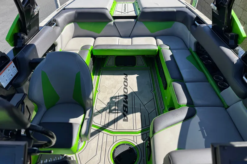 Slide: The Image of Interior of 2021 Moomba Kaiyen boat with gray and green seating. - 20