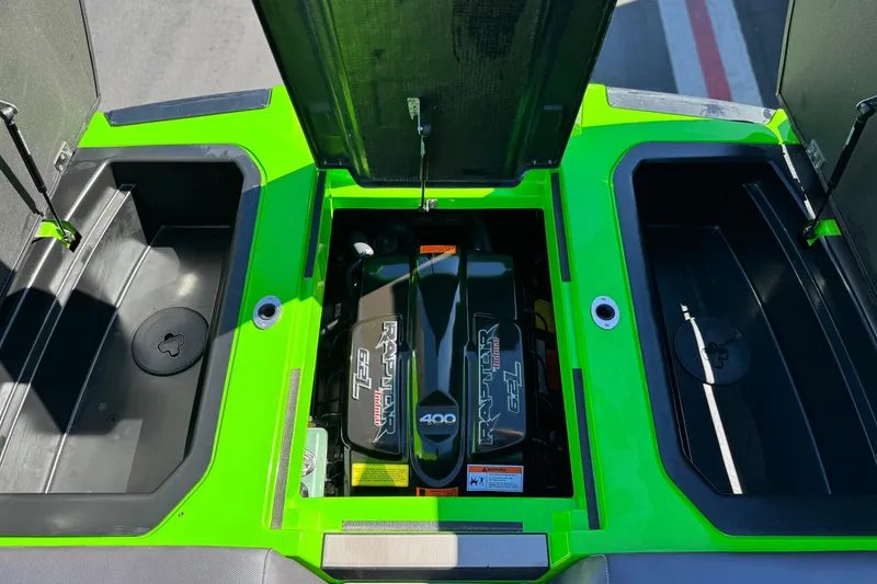 Slide: The Image of 2021 Moomba Kaiyen engine compartment with vibrant green accents and Raptor motor. - 24