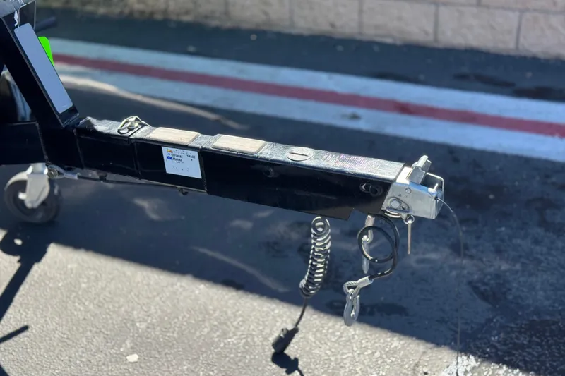 Slide: The Image of Trailer hitch of a 2021 Moomba Kaiyen boat on pavement. - 39