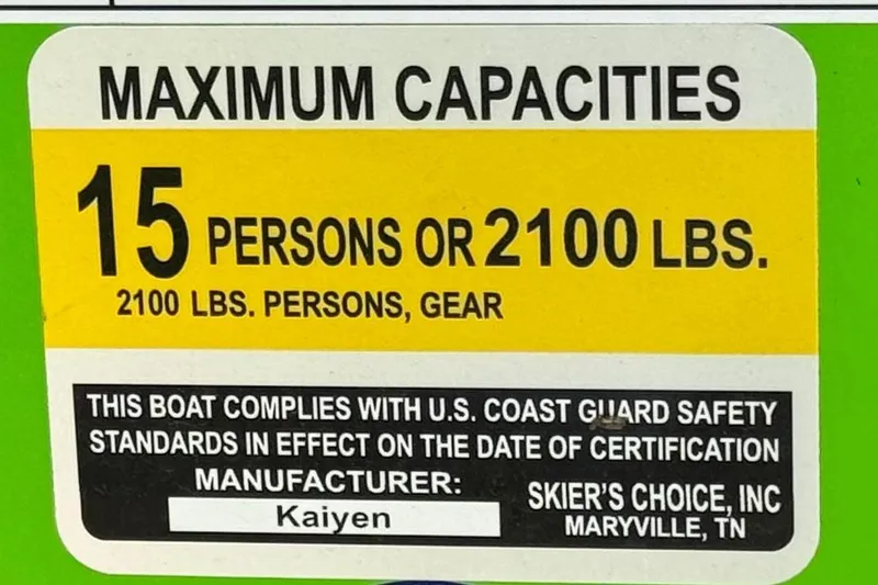 Slide: The Image of 2021 Moomba Kaiyen capacity label: 15 persons or 2100 lbs, U.S. Coast Guard compliant. - 40