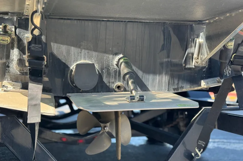 Slide: The Image of Rear view of a 2021 Moomba Kaiyen boat showing propeller and trim tab details. - 7