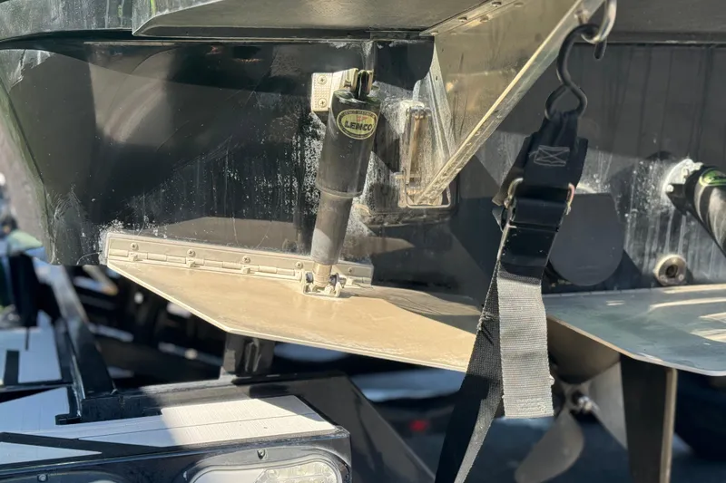 Slide: The Image of Rear view of a 2021 Moomba Kaiyen boat, showcasing trim tab and hardware. - 8