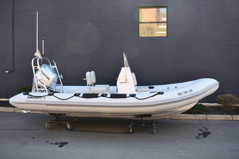 The Image of 2020 Ribcraft 5.85 inflatable boat with Honda engine, parked outdoors. - 0
