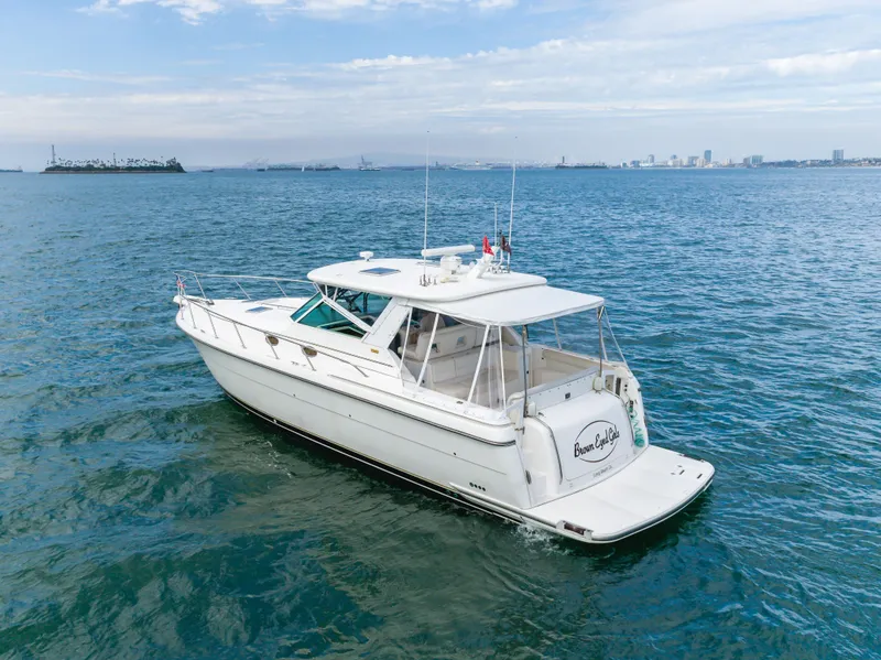 Slide: The Image of 2004 Tiara Yachts 4000 on open sea, clear sky. - 13