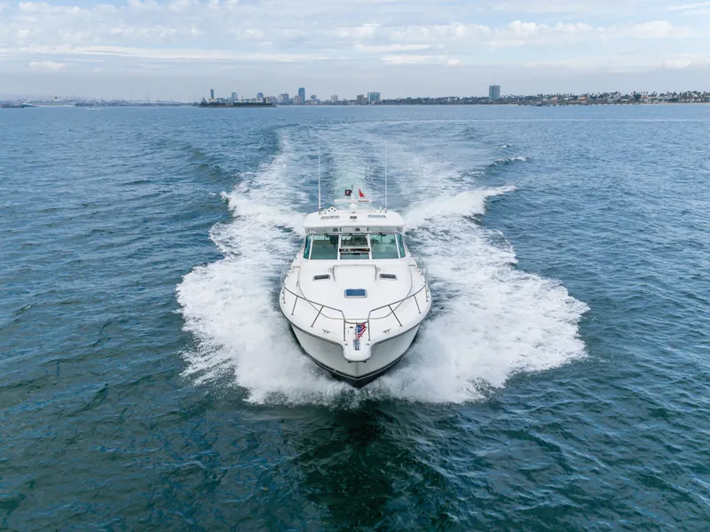 Slide: The Image of 2004 Tiara Yachts 4000 cruising swiftly on open sea. - 21