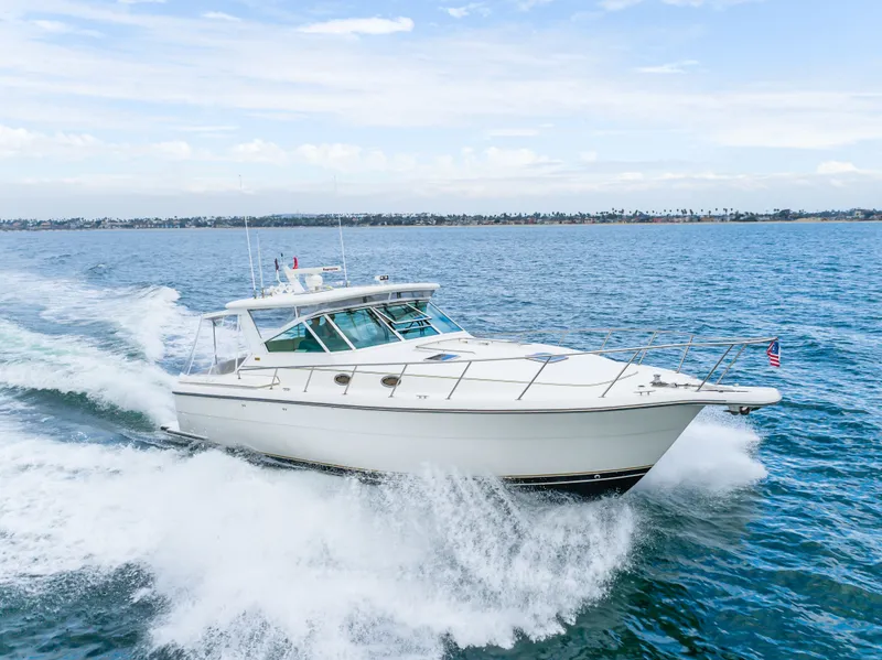 Slide: The Image of 2004 Tiara Yachts 4000 cruising swiftly on open sea. - 23