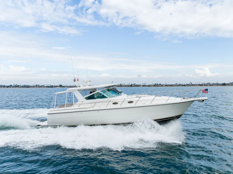 Slide: The Image of 2004 Tiara Yachts 4000 cruising on the ocean under clear skies. - 24