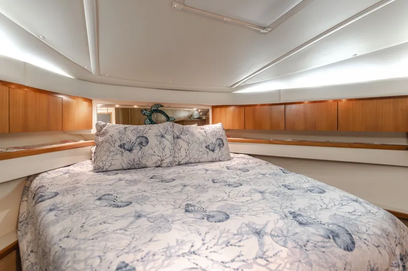 Slide: The Image of Interior of 2004 Tiara Yachts 4000 featuring a cozy bed. - 43