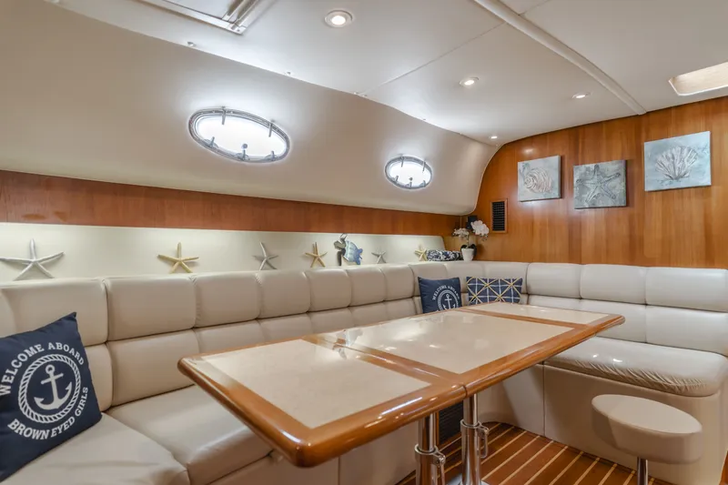 Slide: The Image of Interior of a 2004 Tiara Yachts 4000 with elegant leather seating. - 49