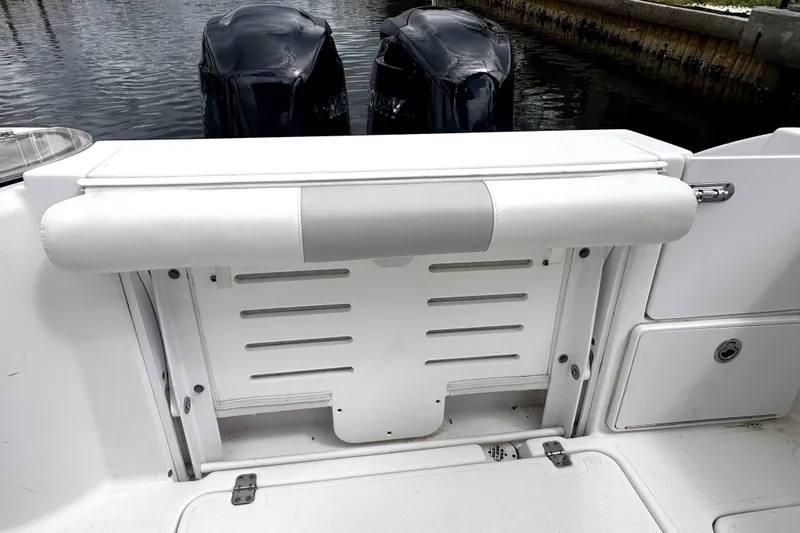 Slide: The Image of 2014 Pro-Line 26 Super Sport boat with dual outboard motors, rear seating view. - 34