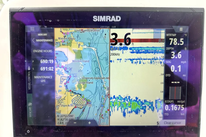 Slide: The Image of Simrad marine display showing navigation and depth data on a 2014 Pro-Line 26 Super Sport. - 46