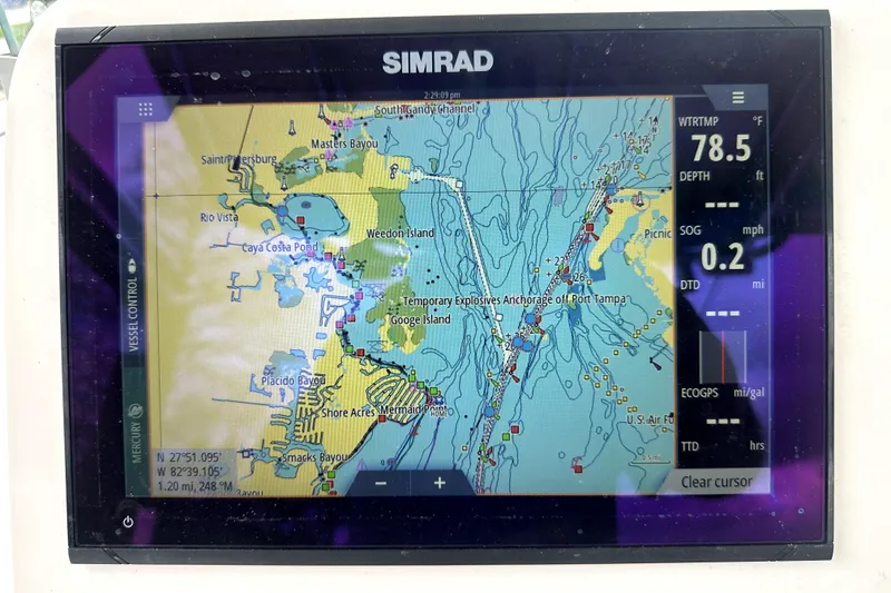 Slide: The Image of Simrad marine GPS display on 2014 Pro-Line 26 Super Sport, showing Tampa Bay navigation map. - 47