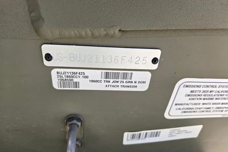 Slide: The Image of 2025 Tracker Grizzly 1860 CC boat identification and emissions control labels. - 12