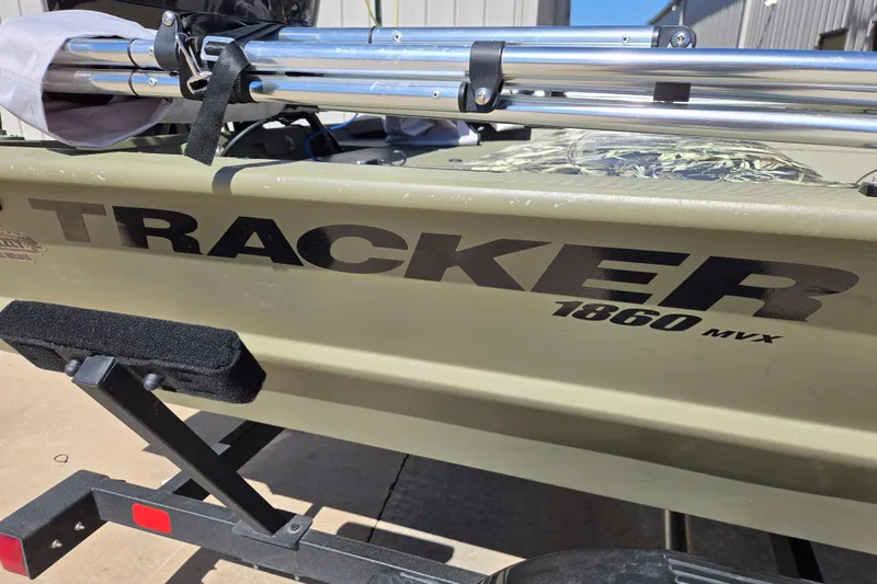 Slide: The Image of 2025 Tracker Grizzly 1860 CC boat on trailer, showcasing model name and details. - 4