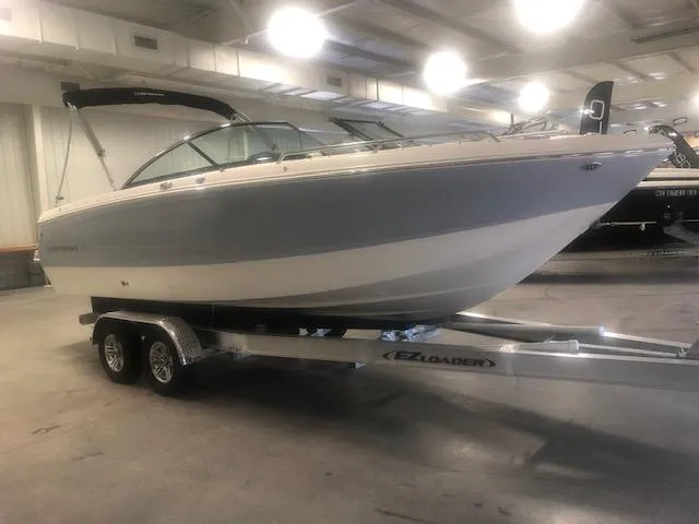 Slide: The Image of 2022 Chaparral 247 SSX boat on trailer indoors. - 2