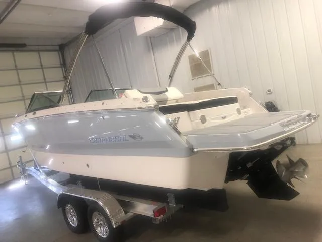 Slide: The Image of 2022 Chaparral 247 SSX boat in warehouse on trailer. - 3
