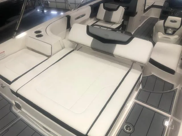Slide: The Image of Interior of a 2022 Chaparral 247 SSX boat with luxurious white seating. - 4
