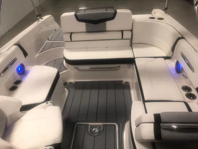 Slide: The Image of Interior of 2022 Chaparral 247 SSX with luxurious white seating. - 9