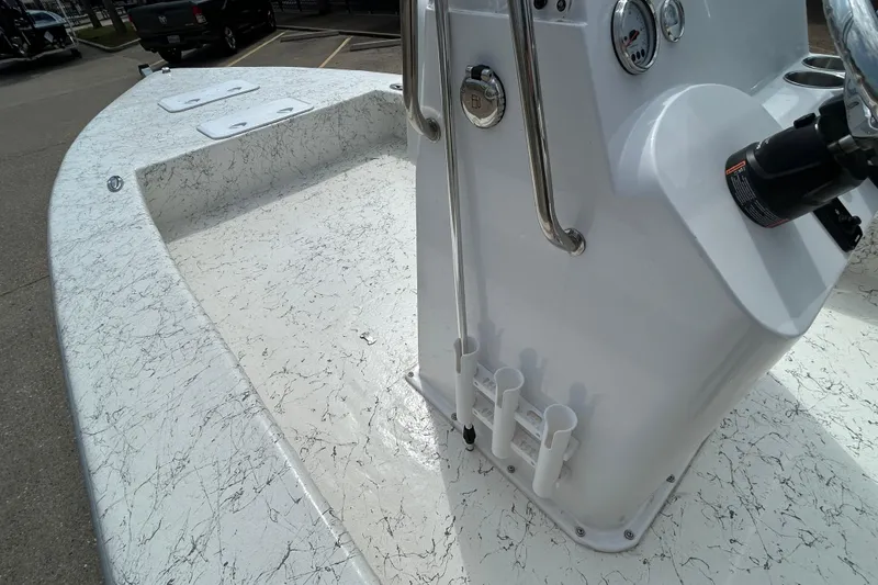 Slide: The Image of 2026 Coastal Skiff 231 Flats boat interior with textured flooring and control panel. - 12