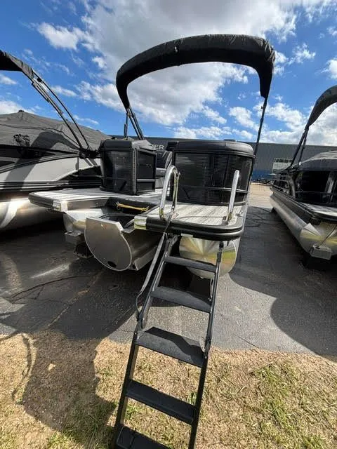 Slide: The Image of Bennington S Series 22 SSR pontoon boat, 2026 model, with ladder and canopy. - 13