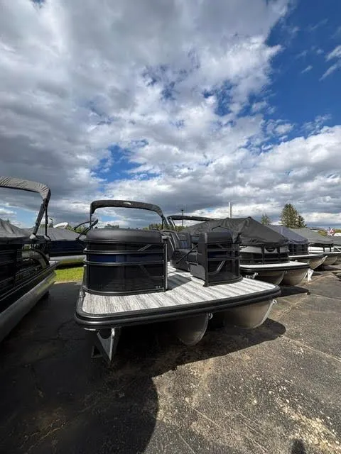 Slide: The Image of 2026 Bennington S Series 22 SSR pontoon boat under cloudy sky. - 15