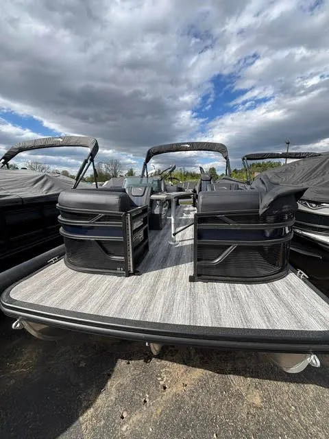 Slide: The Image of 2026 Bennington S Series 22 SSR pontoon boat under cloudy sky. - 16