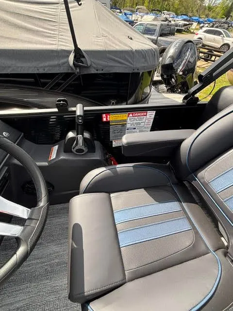 Slide: The Image of Interior of 2026 Bennington S Series 22 SSR with steering and seat. - 8