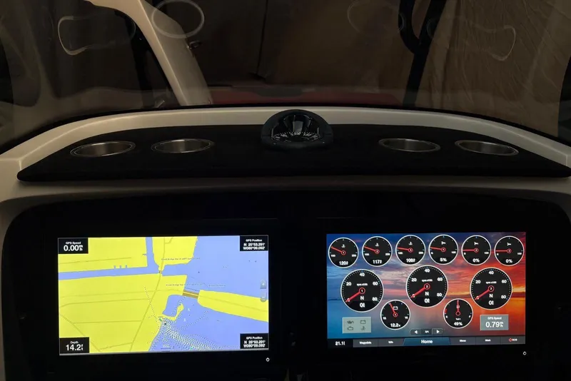 Slide: The Image of Dashboard of a 2021 Renegade 33 boat with navigation and instrument displays. - 5